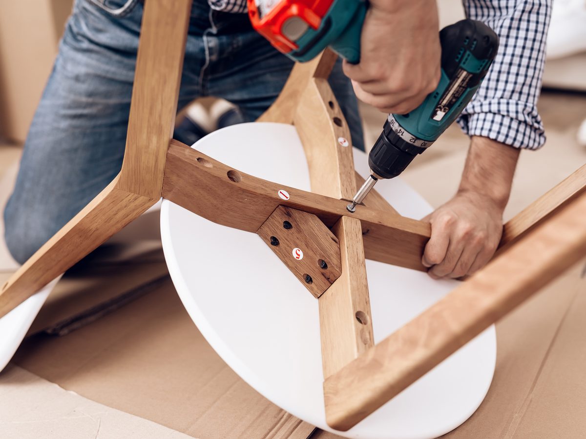 Assembling furniture as part of a home maintenance service call